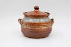 Lidded casserole dish by Len Castle, stoneware with shino glaze (minor hairline cracks), sold Feb 2026