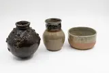 New Zealand Studio Pottery, Two small vases and a bowl, comprising a small Barry Brickell vase (with impressed mark), a black oviod vase with rivet detailing and a oatmeal glazed bowl (both unmarked and unidentified)