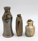 New Zealand Studio Pottery, Three small bottles, comprising a tiny Chester Nealie bottle with cork stopper (with impressed mark), a Barry Brickell small slender vase (with impressed mark) and another small lidded bottle