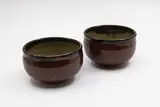 Barry Brickell, Pair of bowls, stoneware with tenmoku glaze to the outside and oatmeal to the inside