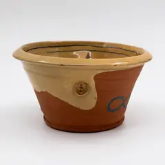 Paul Maseyk, Pinched bowl, terracotta partially glazed in mustard yellow and decorated with blue motifs (tiny chip under rim)