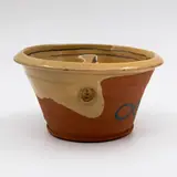 Paul Maseyk, Pinched bowl, terracotta partially glazed in mustard yellow and decorated with blue motifs (tiny chip under rim)