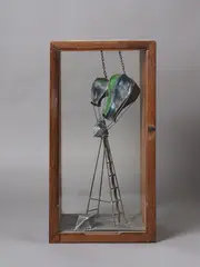 Greer Twiss, Balloon Launch, cast lead and brass, pigment in artist’s wood and glass vitrine (1988)