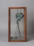 Greer Twiss, Balloon Launch, cast lead and brass, pigment in artist’s wood and glass vitrine (1988)