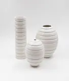 John Parker, Cylinder vase and two ovoid vases, white glazed ceramic