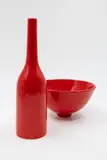 John Parker, Bottle vase and bowl, red glazed ceramic, two pieces