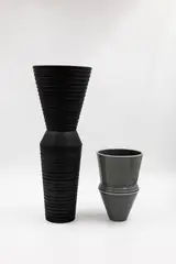 John Parker, Two conical vases, matt charcoal glaze and shiny grey glaze