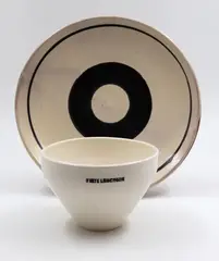Bowl and plate by Martin Poppelwell, white glazed ceramic bowl stamped State Luncheon, plate with black 'O' decoration, offered May 2025