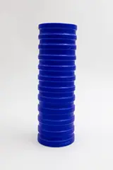 Grooved vessel by John Parker, blue glazed ceramic, sold May 2025