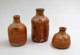 Len Castle, Three stoneware bottles, shino glazed stoneware