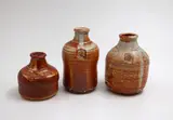 Len Castle, Three stoneware bottles, shino glazed stoneware