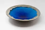Len Castle, Crater Lake bowl, earthenware with rich alkaline blue glaze to the interior, matt grey stained sculptured cavetto and black glaze exterior (AF)
