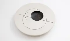 Leo King, Flattened bowl, with a flat circular top, and an off-centre opening, matt white glaze decorated with manganese glazed circular lines, the interior also with manganese glaze