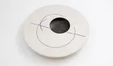 Leo King, Flattened bowl, with a flat circular top, and an off-centre opening, matt white glaze decorated with manganese glazed circular lines, the interior also with manganese glaze