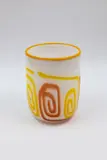 Tony Kuepfer, Cylindrical vase, blown glass with orange and yellow decoration on a white ground