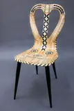 Fornasetti Milano, Vintage Musicale chair, lithographically printed and hand coloured lacquered wood, with metal tubular legs, designed in 1951, manufactured in 1989