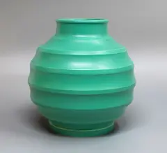 Matt green spherical vase by Keith Murray for Wedgwood, with lathe turned concave bands, sold May 2025