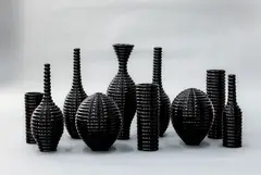 John Parker, Vortex Ware Still Life, shiny black glazed porcelain, 10 parts