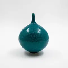 Peter Collis, Small turquoise vase, porcelain with thinly crackled glaze, of globular form with spire neck
