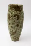 Māori inspired vase by Sang Sool Shim & Keum Sun Lee, stoneware glazed in green and olive with incised tiki design, sold May 2025