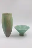 Set of Māori inspired porcelains by Sang Sool Shim & Keum Sun Lee, comprising a tall vase and a footed bowl, both with matching aqua-green glaze and incised Māori design, sold May 2025
