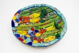Large wall hanging charger by Sang Sool Shim & Keum Sun Lee, glazed and painted ceramic with applied sculptural decoration, sold May 2025