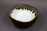 Graeme Storm, Squared circular bowl, stoneware with poured dark iron glaze to the rim and exterior, pale blue glaze to the interior