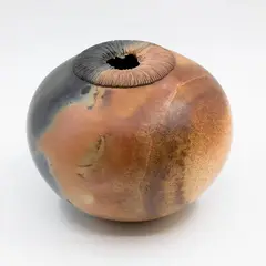Jo Munro, Raku fired vase, of globular form with mushroom shaped rim
