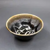 Graeme Storm, Porcelain bowl, with tenmoku glaze with white highlights to the interior