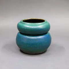 Double lobed vase by Graeme Storm, stoneware with matt dark green and blue barium glaze, sold May 2025