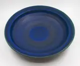 Graeme Storm, Large wall charger, stoneware with rich matt blue barium glaze, thinning to pale green to the rim, fitted with hanging wire