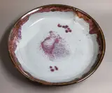 Graeme Storm, Large shallow bowl, stoneware with jun glaze to the interior, tenmoku glaze to the exterior
