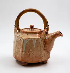 Peter Alger, Hexagonal teapot with bamboo handle, stoneware with fine shino glaze