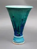 Graeme Storm, Porcelain trumpet vase, of faceted form, with gloss green-blue barium glaze