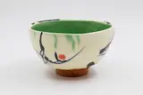 Campbell Hegan, Abstract terracotta bowl, raised on an unglazed foot, the sides with a thick layer of white glaze with abstract decoration, the interior glazed in green