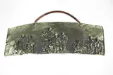 Toby Stafford, Wall plaque, white earthenware with high relief decoration of three groups of people covered with a finely crackled matt moss-green glaze, hand-made copper hanger, made in the early 2000s