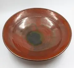 Ray Rogers, Large table bowl, with speckled brown glaze giving to a blue-green pool to the centre