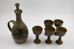 Adrian Cotter, Wine jug and five goblets, stoneware with ash glaze, decorated with a wax resist spiral design