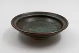 Small bowl by Len Castle, stoneware with mottled matte green and tenmoku glazes, sold May 2025