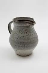 Stoneware jug by Len Castle, matt grey glaze over iron glaze, sold May 2025