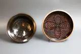 Graeme Storm, Stoneware bowl and dish, with wax resist designs on tenmoku glaze