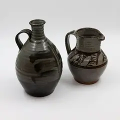 Peter Stichbury, Stoneware wine bottle and jug, with similar over saturated iron glaze and grey glazes