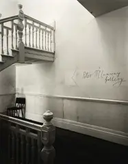 Andrew Ross, Approach to the Peter McLeavey Gallery (with the original sign), gold-toned gelatin silver print