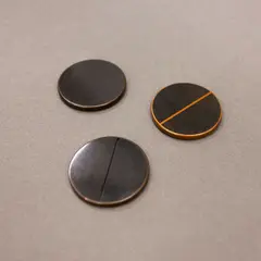 John Edgar, Coins of the New Realm, three coins made with argylite, copper and glass in artist's wooden case