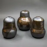 Graeme Storm, Set of three gourd vases, stoneware with manganese glaze with gold highlights