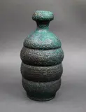 Graeme Storm, Ribbed bottle vase, stoneware with dark green copper carbonate and dark manganese glazes