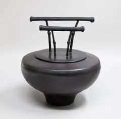 Anneke Borren, Black on black bamboo lid pot, with wax resist abstract decoration on a charcoal ground