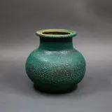 Graeme Storm, Stoneware vase, of compressed spherical form, with dark green copper carbonate glaze with dark highlights