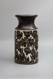Graeme Storm, Tall porcelain vase, the tall oval body decorated with sgraffito cut floral design through a dark manganese slip