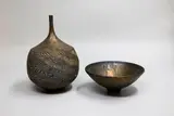 John Parker, Bronze glaze spire vase and matching bowl, the vase with heavily scored sides